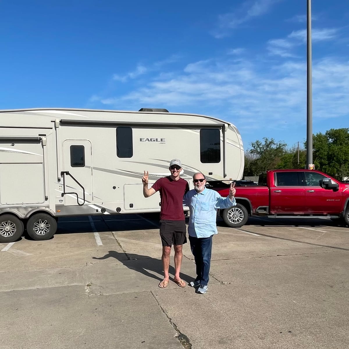 John and Buster in front of the fifth-wheel trailer