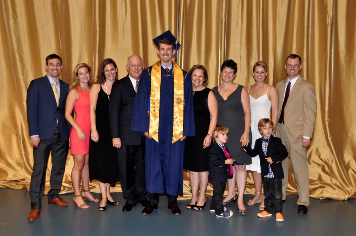 John at his UC Davis graduation, surrounded by his family